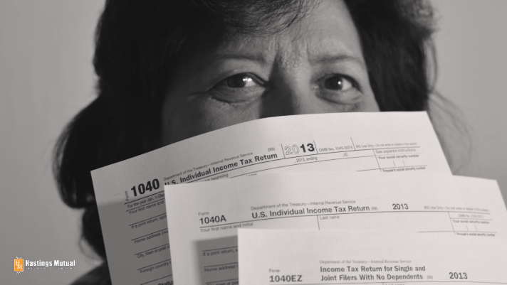 woman holding tax forms