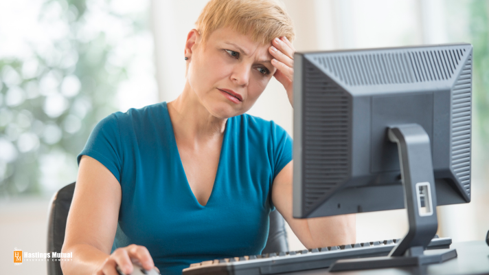 Confused woman sitting at computer