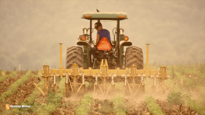 farmer on tractor spraying crops