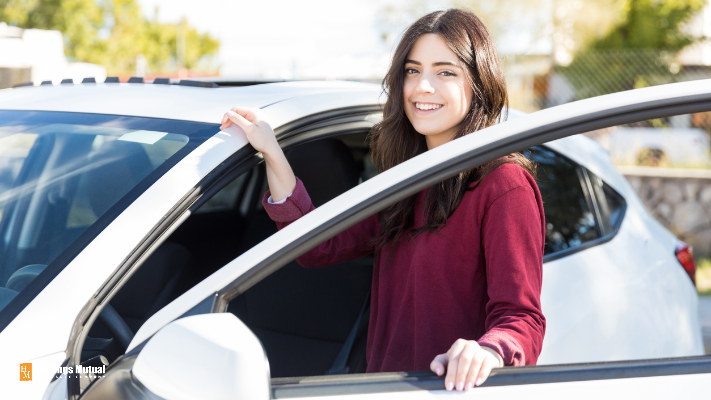 young woman getting into car