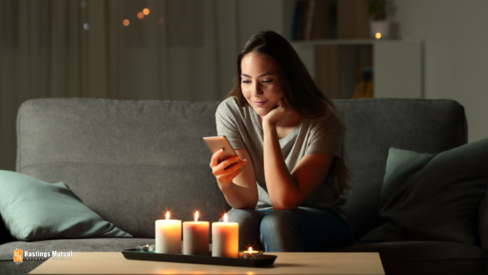 woman on couch in candle light