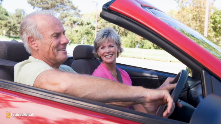 senior elderly man and woman driving car