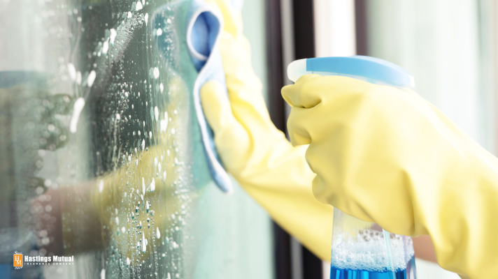 Cleaning a window with spray cleaner: cleaning supplies are a basic need; food is even more important.